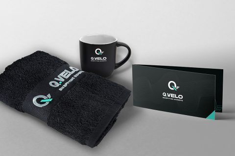Q.VELO Gutschein-Bundle – Gutschein, Handtuch, Tasse